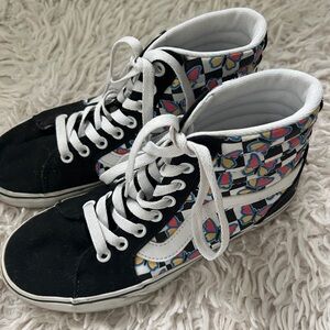 Black and white Vans high top sneakers with multi-coloured butterfly design